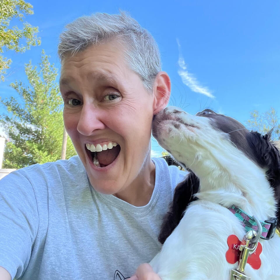 holly with dog kissing her