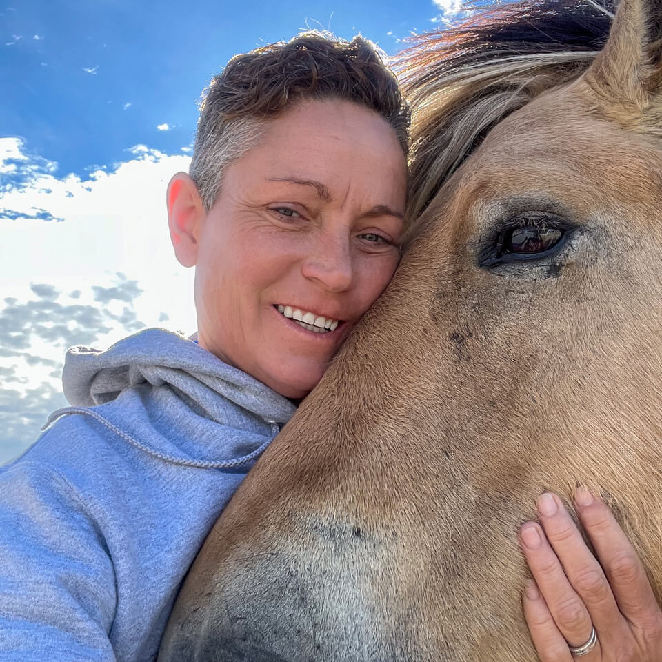 lisa hugging a horse